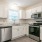 a kitchen with white cabinets