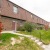 a brick building with a driveway