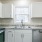 a kitchen with white cabinets